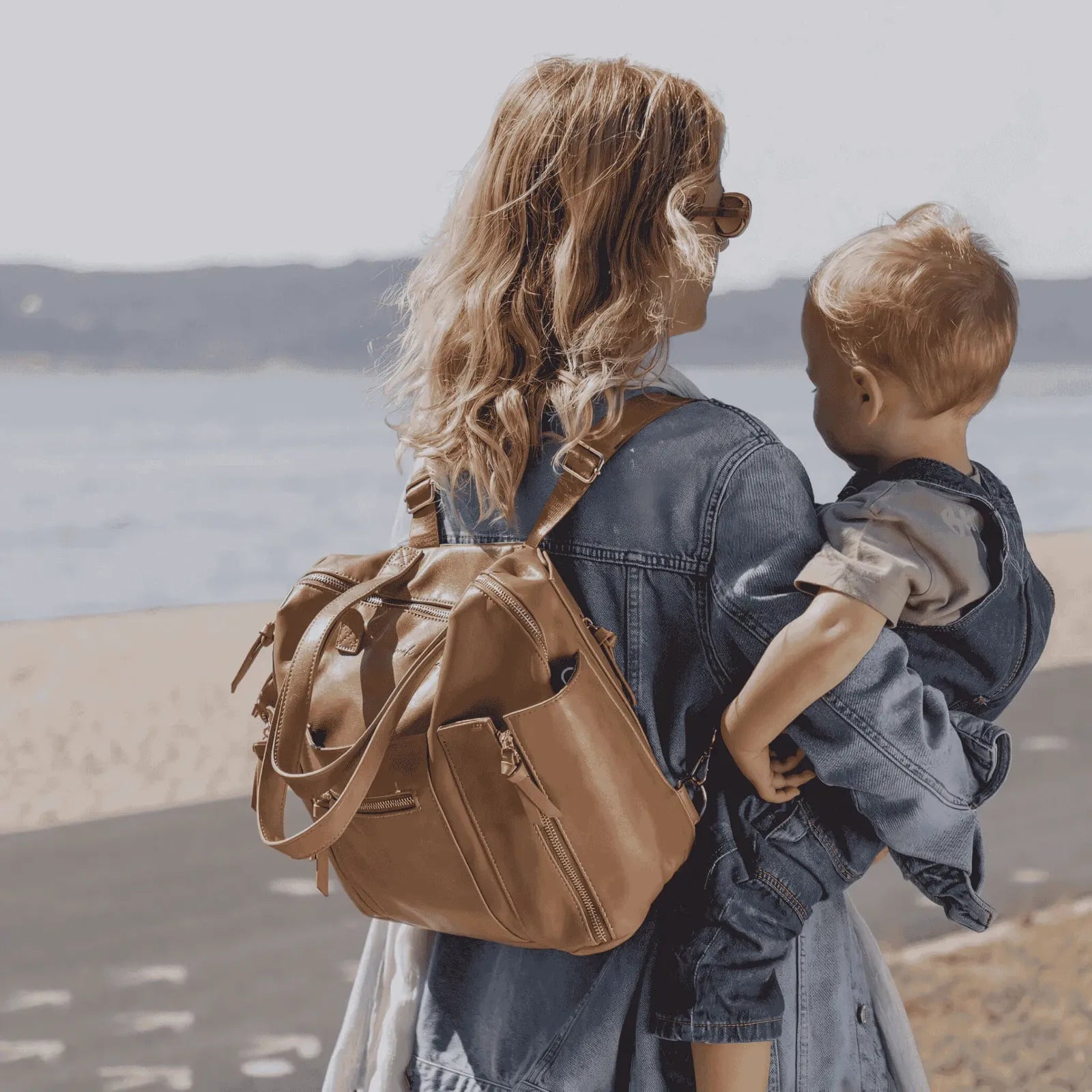 Shop Hannah and Henry's best-selling leather diaper bag. The perfect baby bag for modern parents on the go